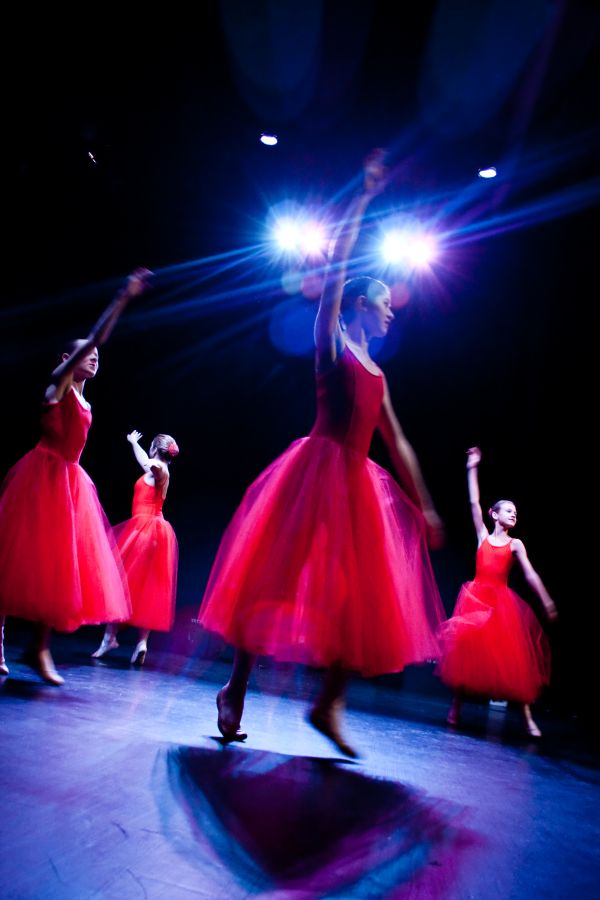 Women in red dresses dancing